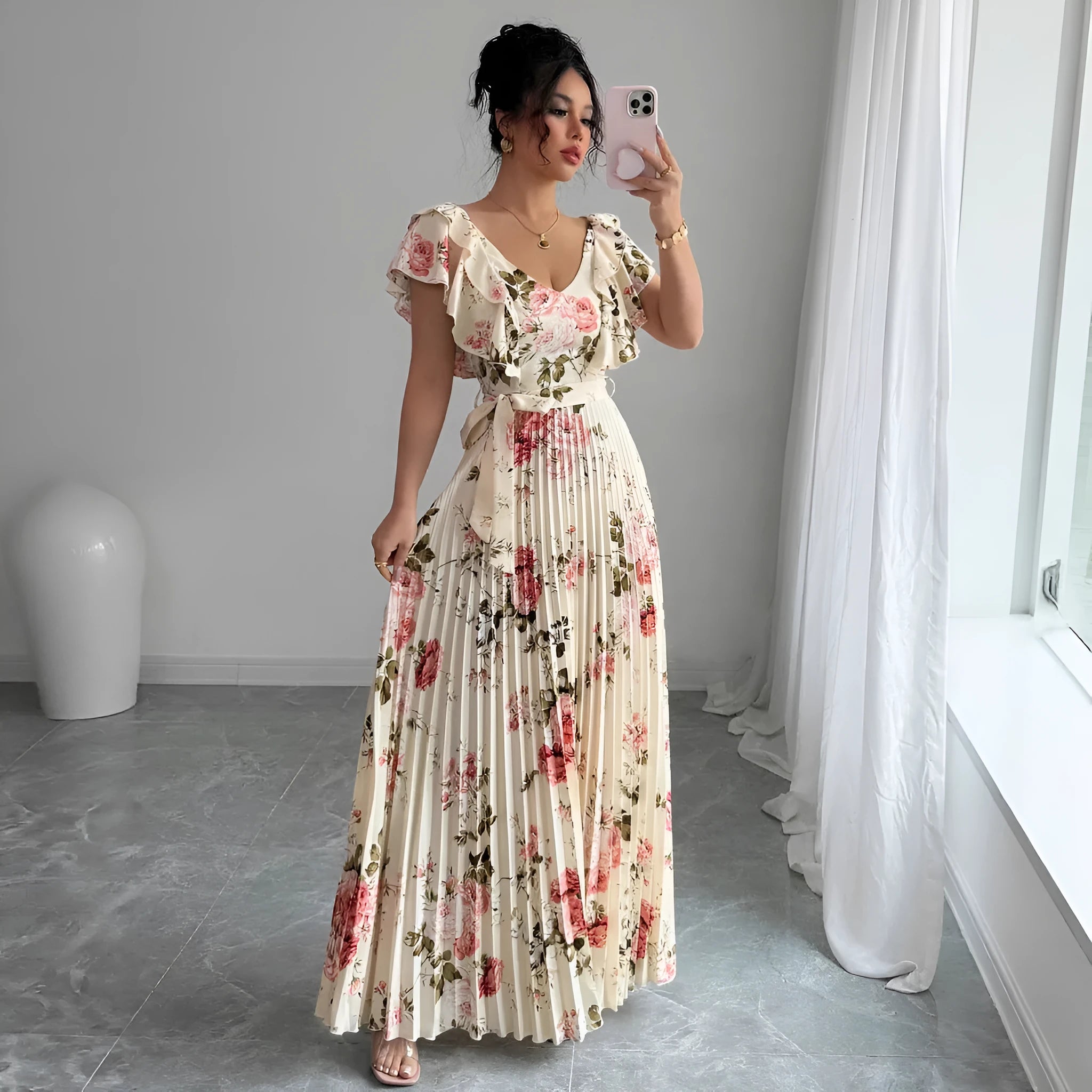 Apricot floral print dress with V-neck, ruffled short sleeves, and a high-waisted pleated swing skirt.