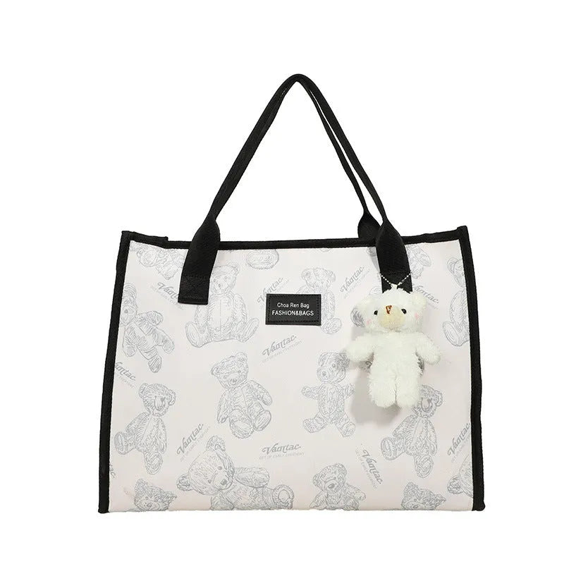 Women's black and white printed canvas tote bag with rhombus pattern and shoulder strap