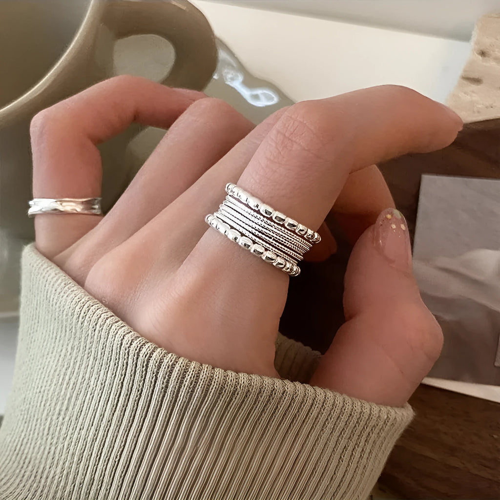 Adjustable opening geometric copper ring with woven twisted multilayer design