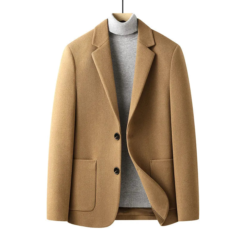 Men's slim fit wool suit jacket in grey on a hanger, showing notch lapel and button front.