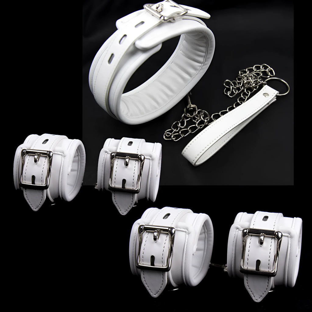 White PU sponge bondage restraint set showing handcuffs, foot cuffs, and a neck cuff.