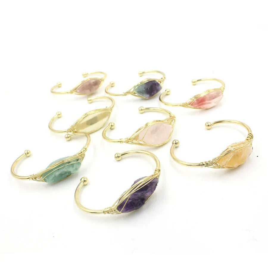 Raw gemstone bracelet with rough 8mm crystal beads in amorphous shapes on wrist, showing unisex ethnic style.