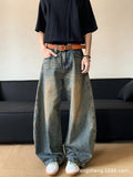 Retro blue distressed machete denim jeans for men with a wide-leg slim cut.