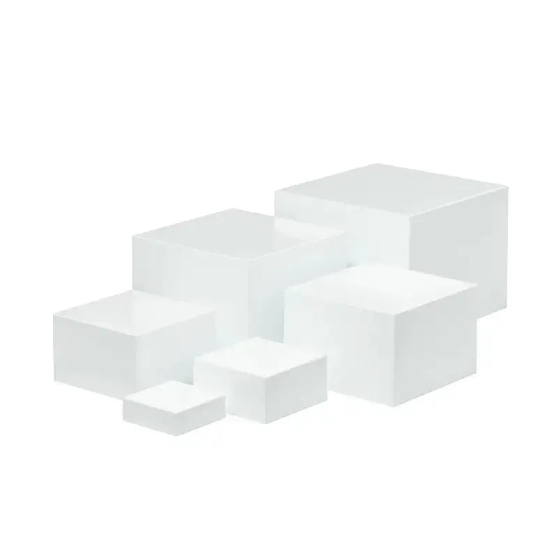 White plastic suit cube dessert display stand with six-piece arrangement for tabletop cake presentation