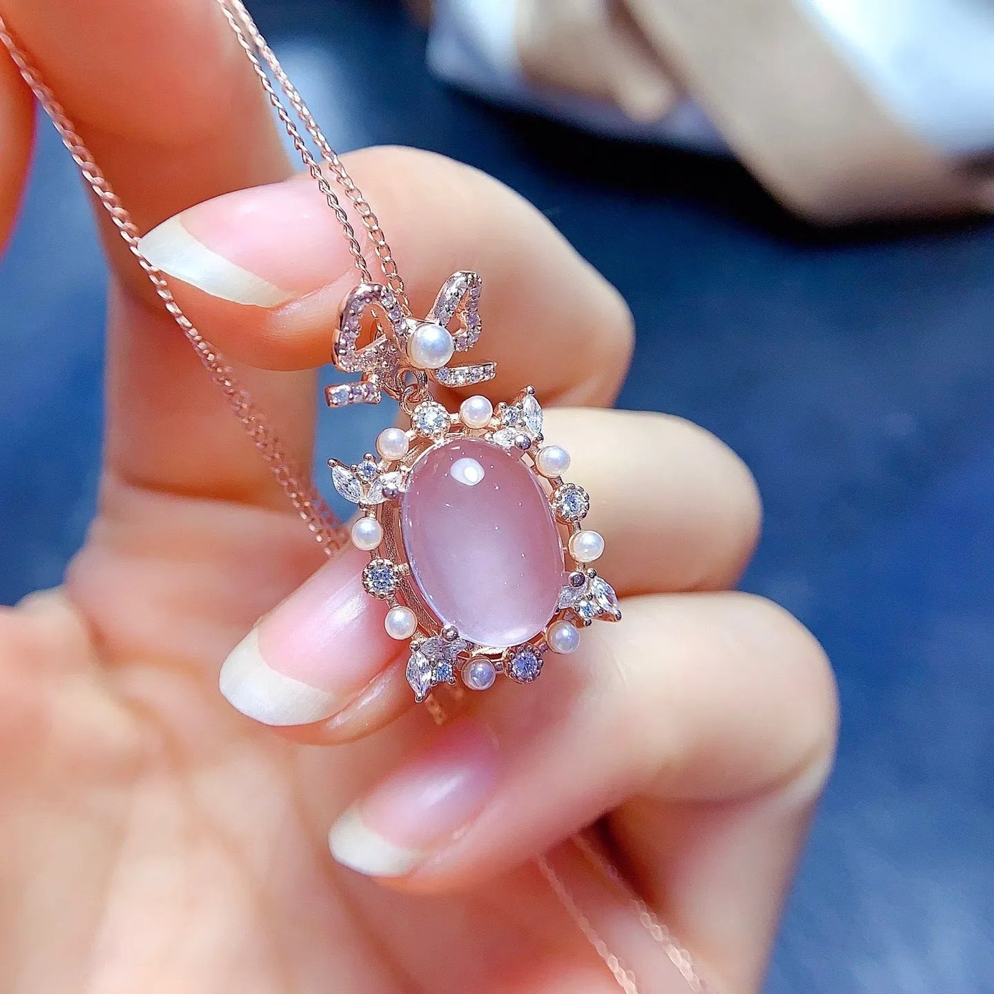 Geometric pink rose quartz pendant on a rose gold plated sterling silver necklace.