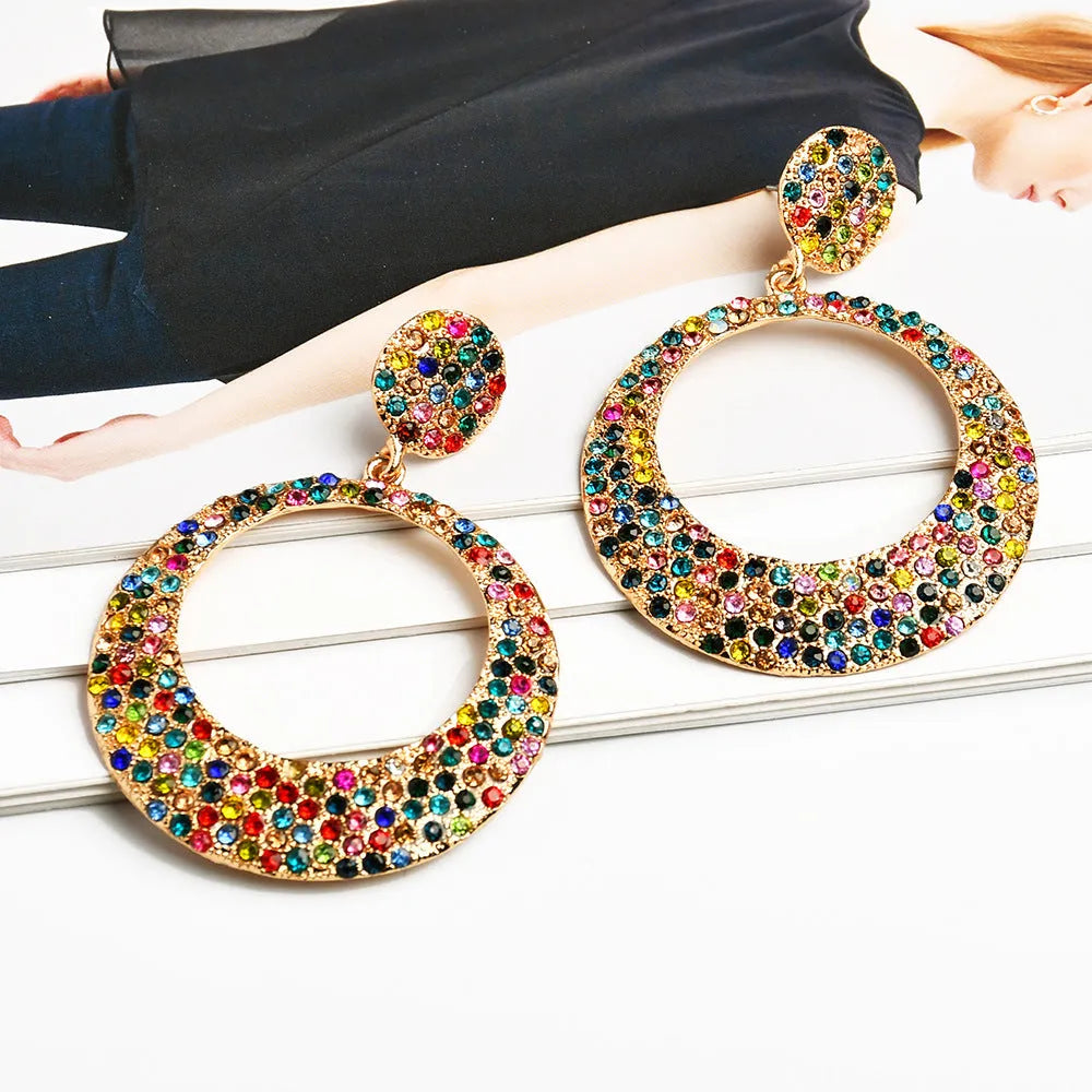 Colourful alloy drop earrings with large round pendants featuring diamond-effect detailing and cartoon-inspired styling