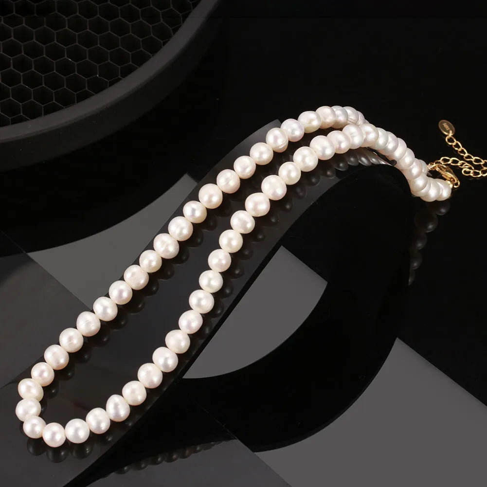 Women's adjustable sterling silver necklace with a single 6-7mm freshwater pearl pendant.