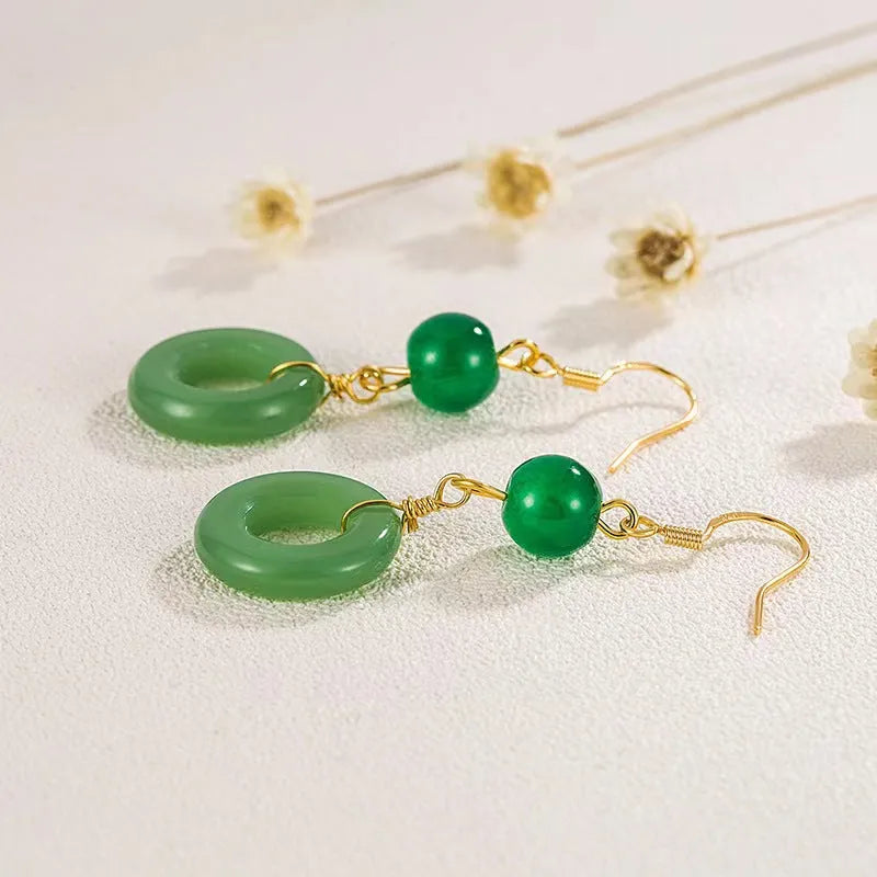 Green jade peace buckle shape earrings with zinc alloy construction and 14K gold plating