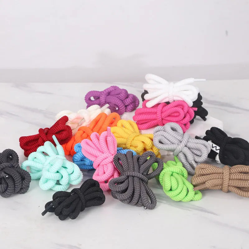 A pair of oval round-style shoelaces in a selected colour, showing their 1.0cm width and length.