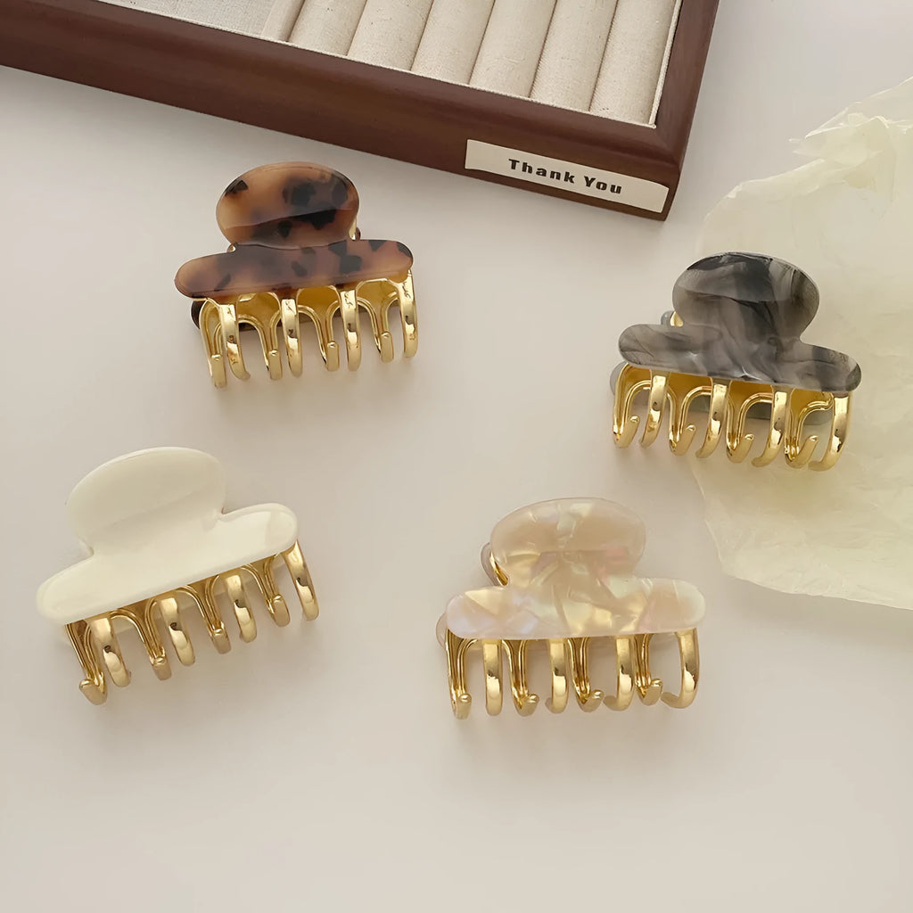 Retro acetate hair barrettes with metal grip in four colour variations including leopard print