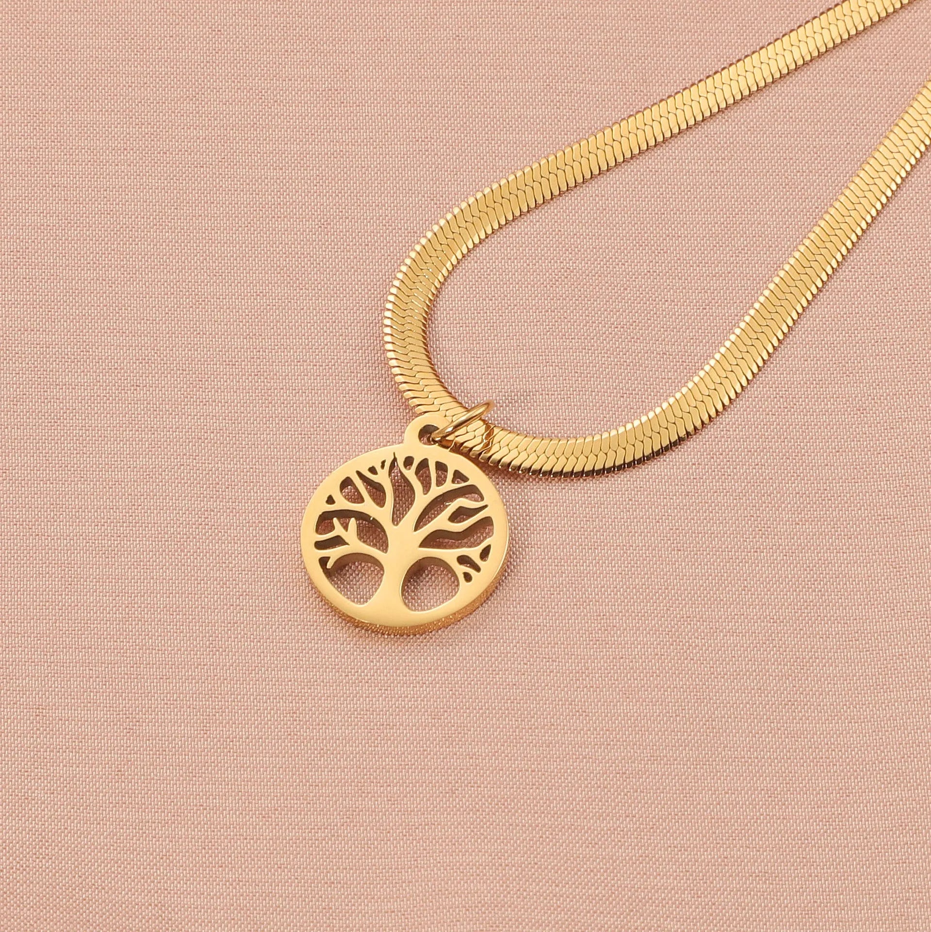 Stainless steel necklace with tree pendant on adjustable snake chain in gold and steel colours.