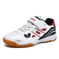 White and blue low-top breathable badminton shoes with ribbed sole on a court surface.
