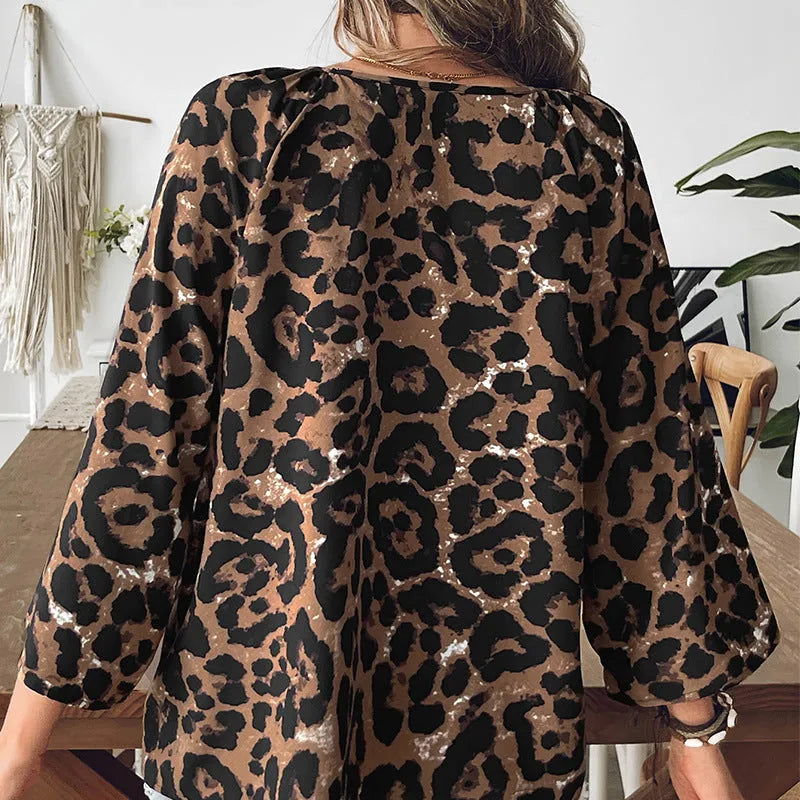 Women's multicolour leopard print polyester pullover top with V-neck and half sleeves on a hanger