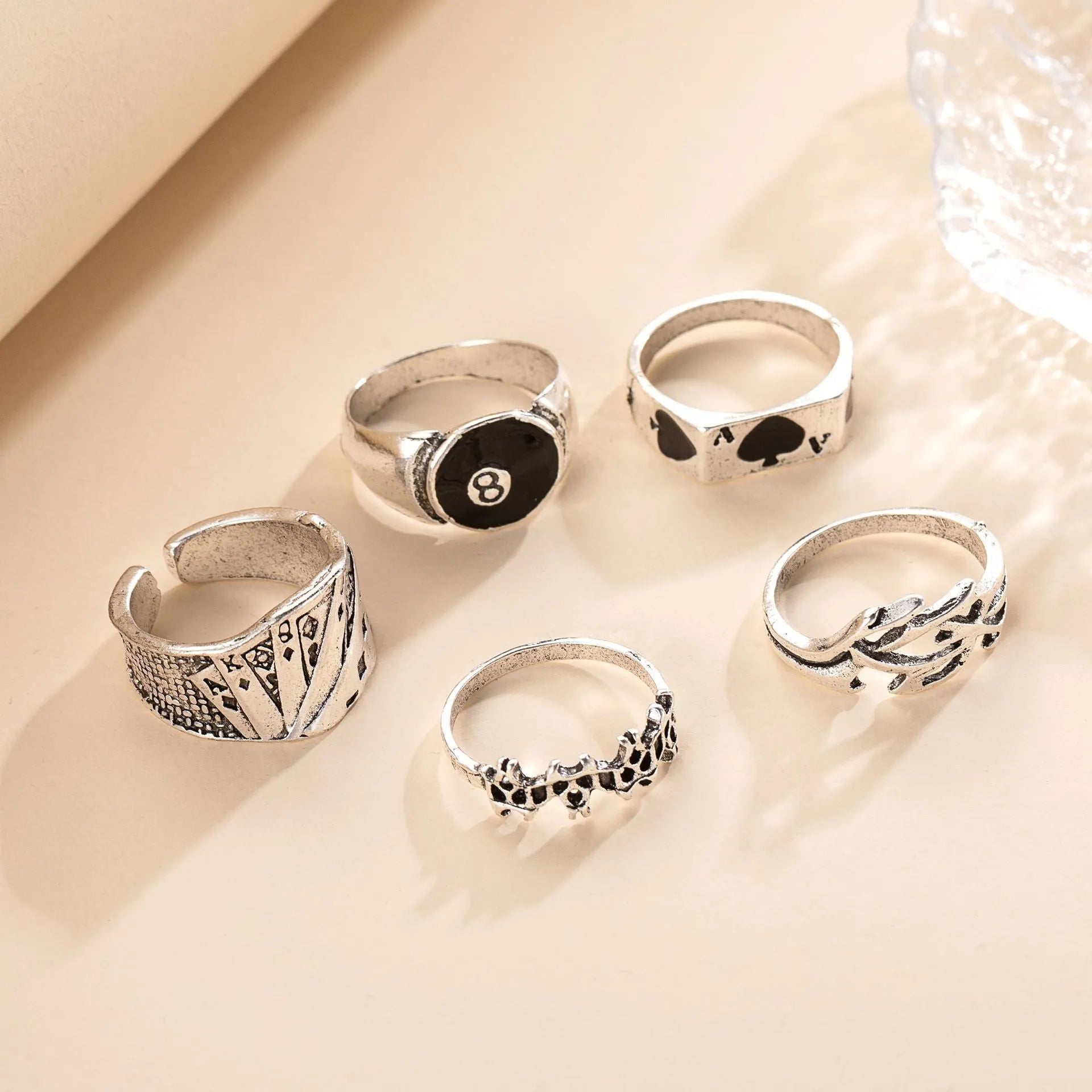 Black alloy poker ring with raised spade card design and adjustable band