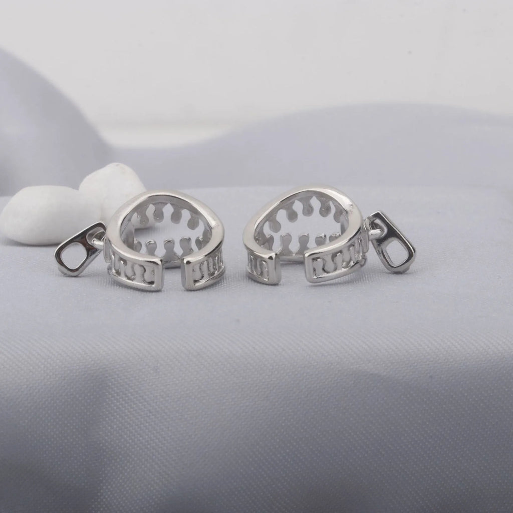 Copper geometric ear clips with zipper design detail in ES862 colour showing bone clip fastening