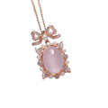 Geometric pink rose quartz pendant on a rose gold plated sterling silver necklace.