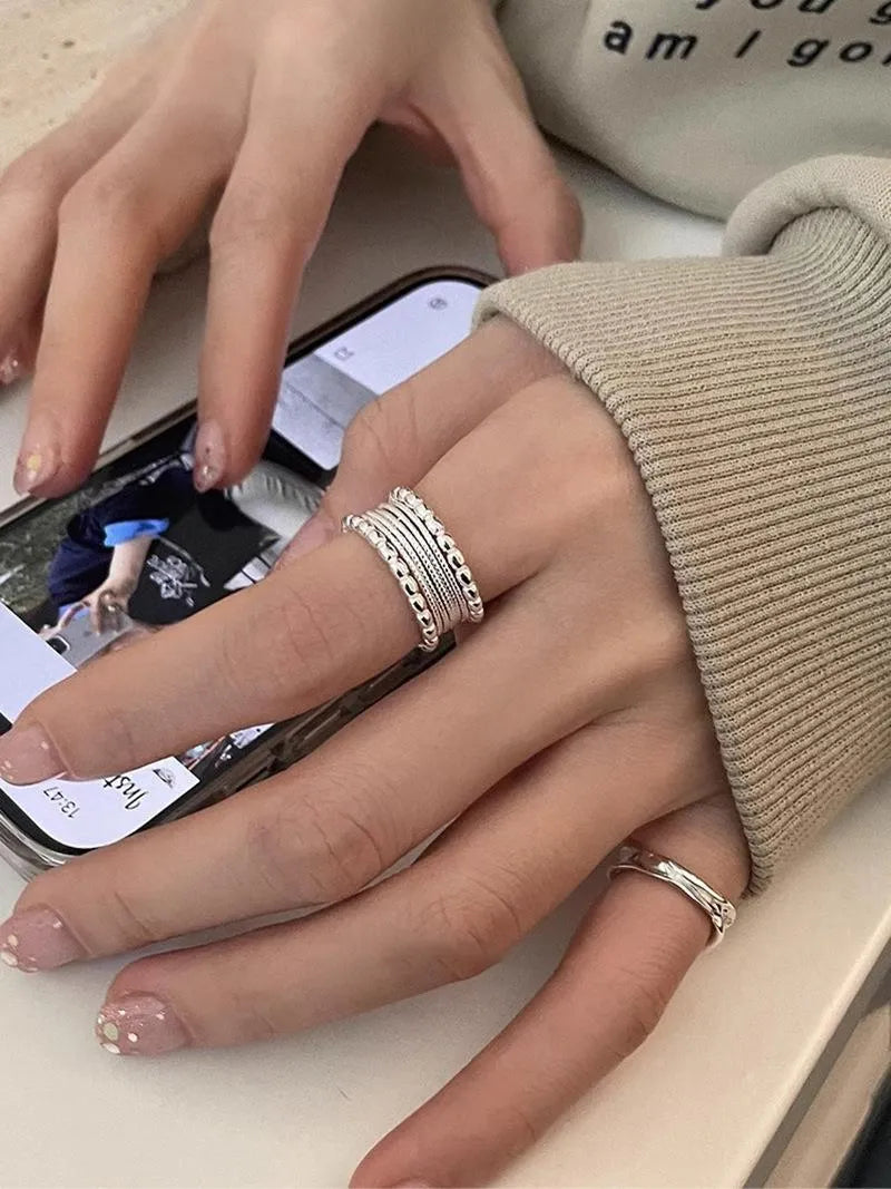 Adjustable opening geometric copper ring with woven twisted multilayer design