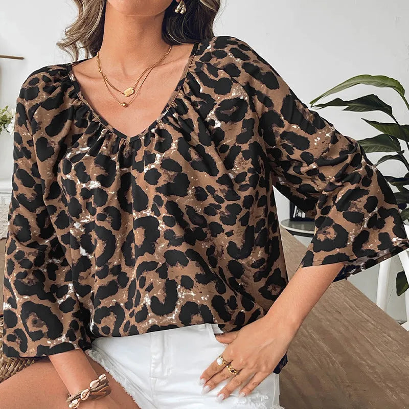 Women's multicolour leopard print polyester pullover top with V-neck and half sleeves on a hanger
