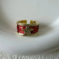 Geometric adjustable copper ring with a distressed finish in black, red, and blue colour options.