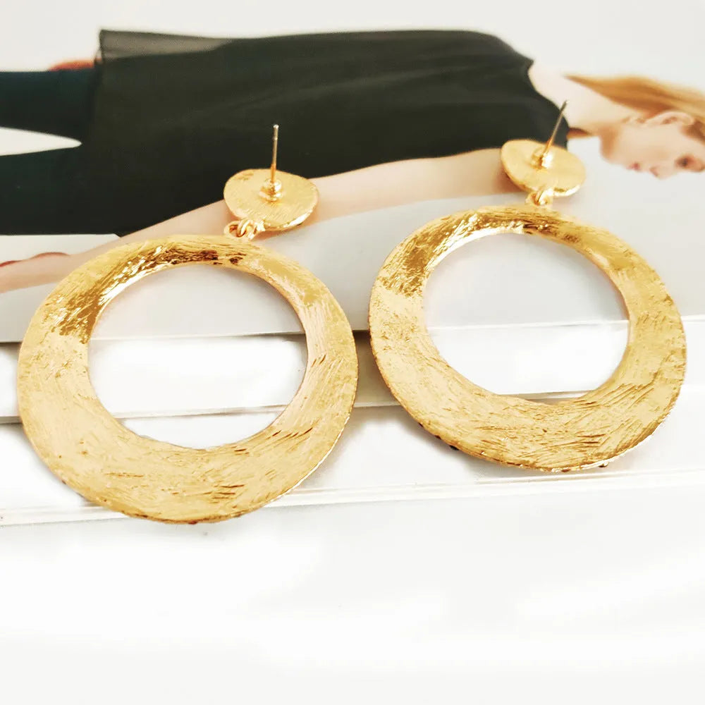 Colourful alloy drop earrings with large round pendants featuring diamond-effect detailing and cartoon-inspired styling