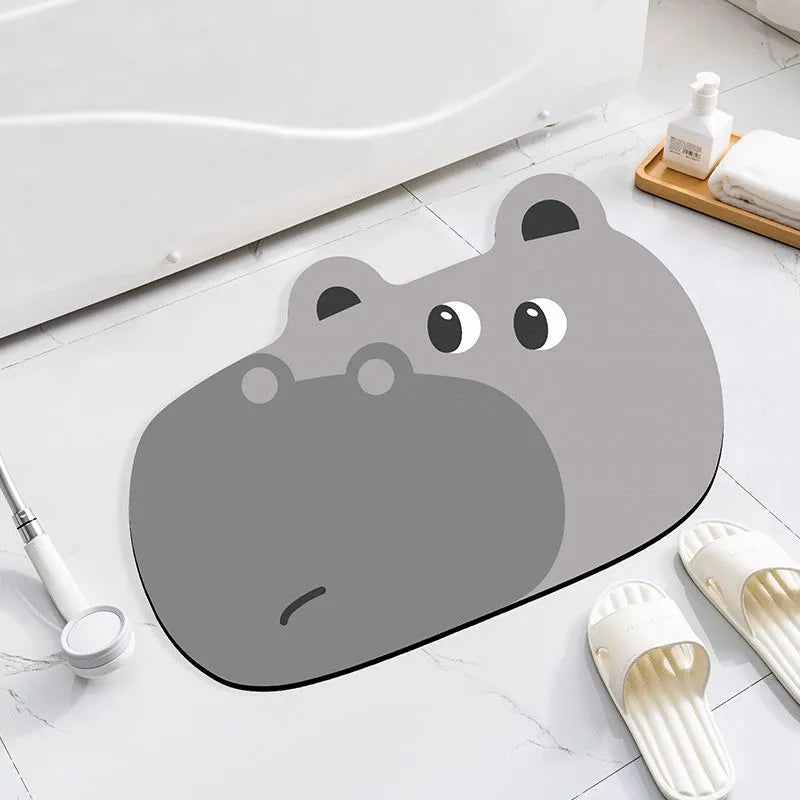 Colourful cartoon animal diatomite absorbent bathroom mat in alien shape on tiled floor.