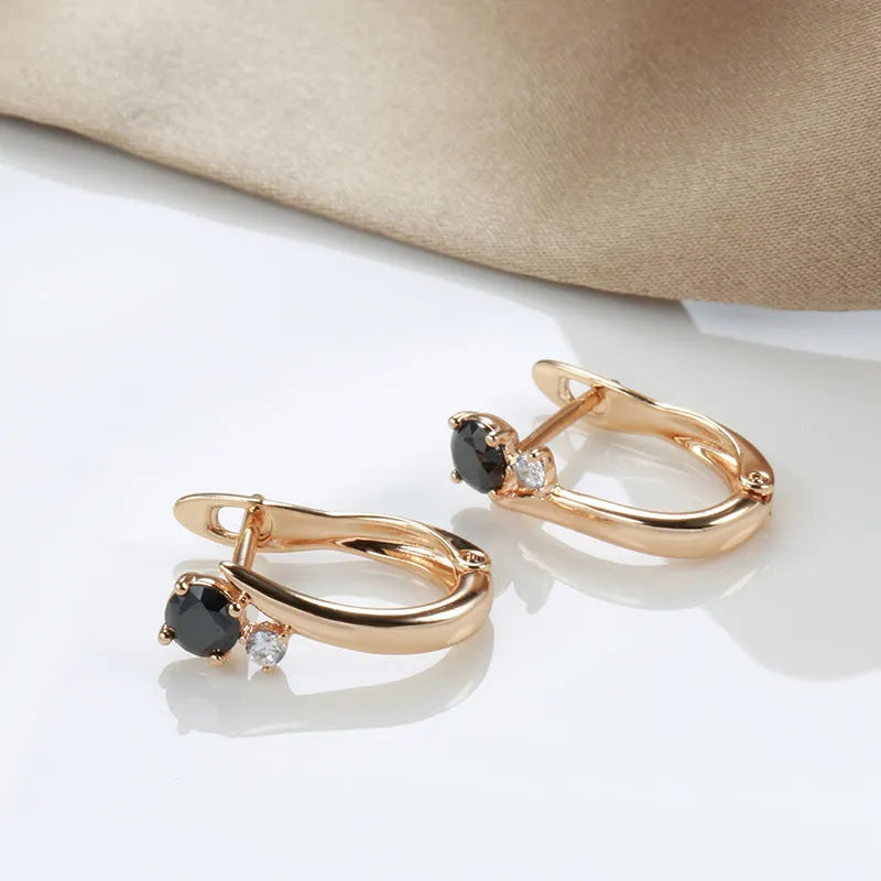 Gold colour geometric drop earrings with a black agate stone inlay for women.