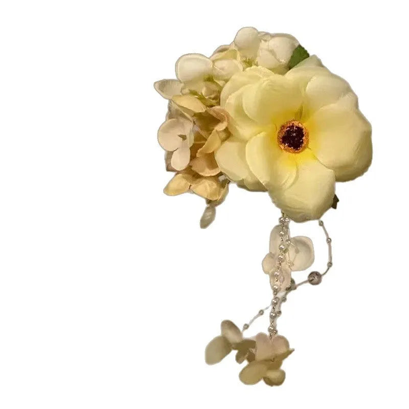 Yellow flower tassel hair accessory clip with manual craft floral decoration
