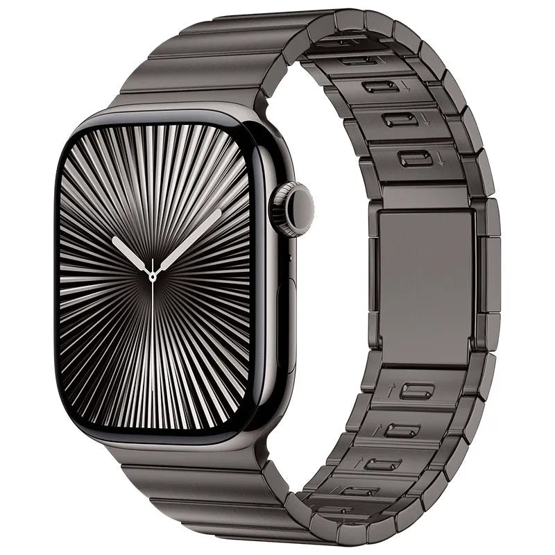 Stainless steel magnetic buckle Apple Watch replacement band in silver colour on a wrist.