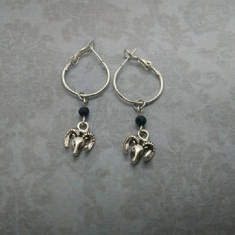 Women's silver tone alloy round ring earrings with geometric design on white background