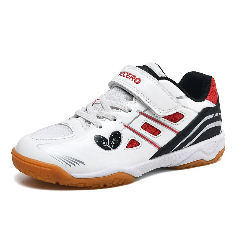 White and blue low-top breathable badminton shoes with ribbed sole on a court surface.