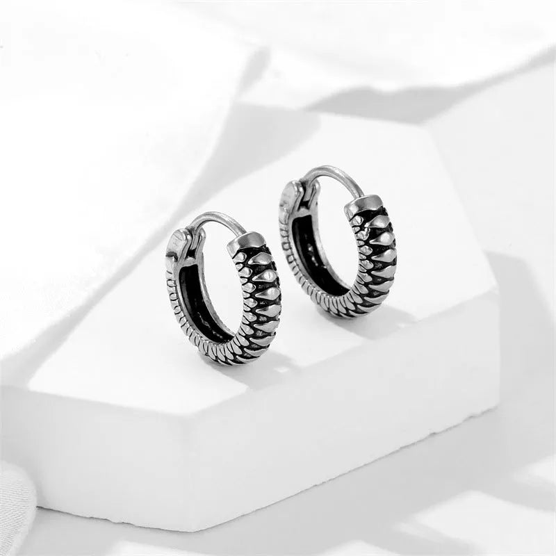 Silver geometric earrings with retro twist design and titanium steel construction