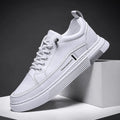 Men's low-top white skateboard shoes with elastic band closure and microfiber upper.