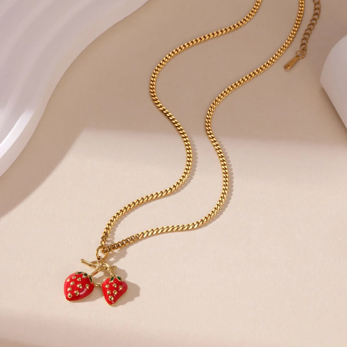 Red strawberry fruit pendant necklace on adjustable stainless steel chain