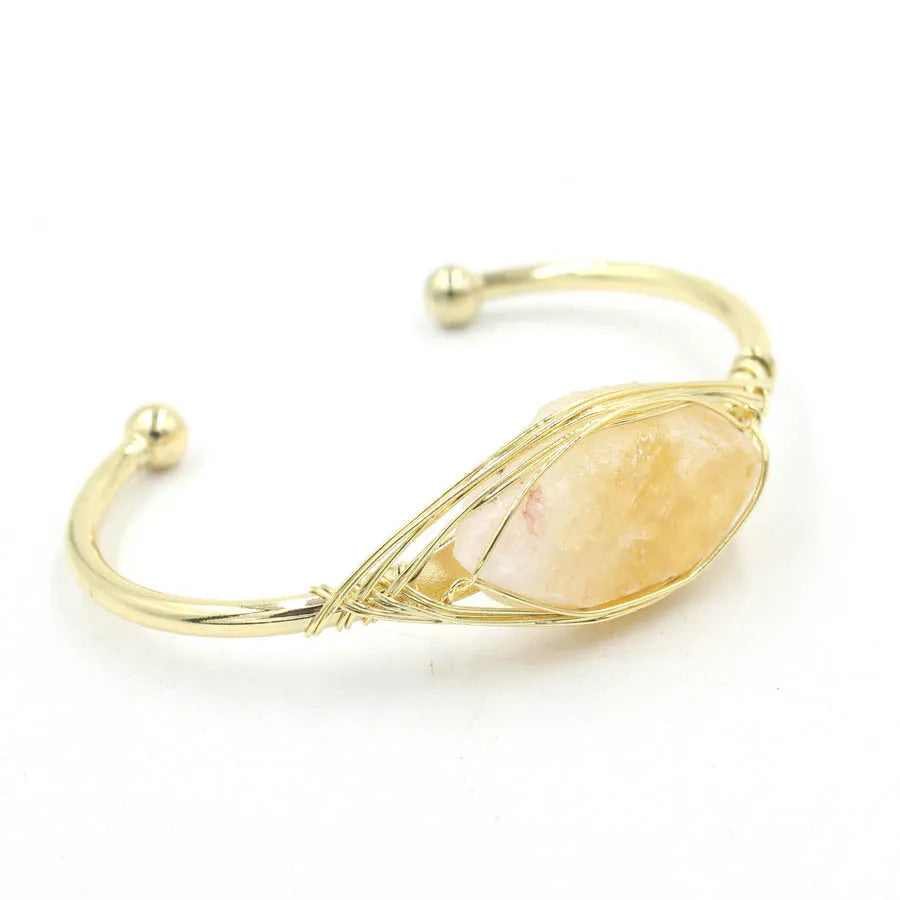 Raw gemstone bracelet with rough 8mm crystal beads in amorphous shapes on wrist, showing unisex ethnic style.