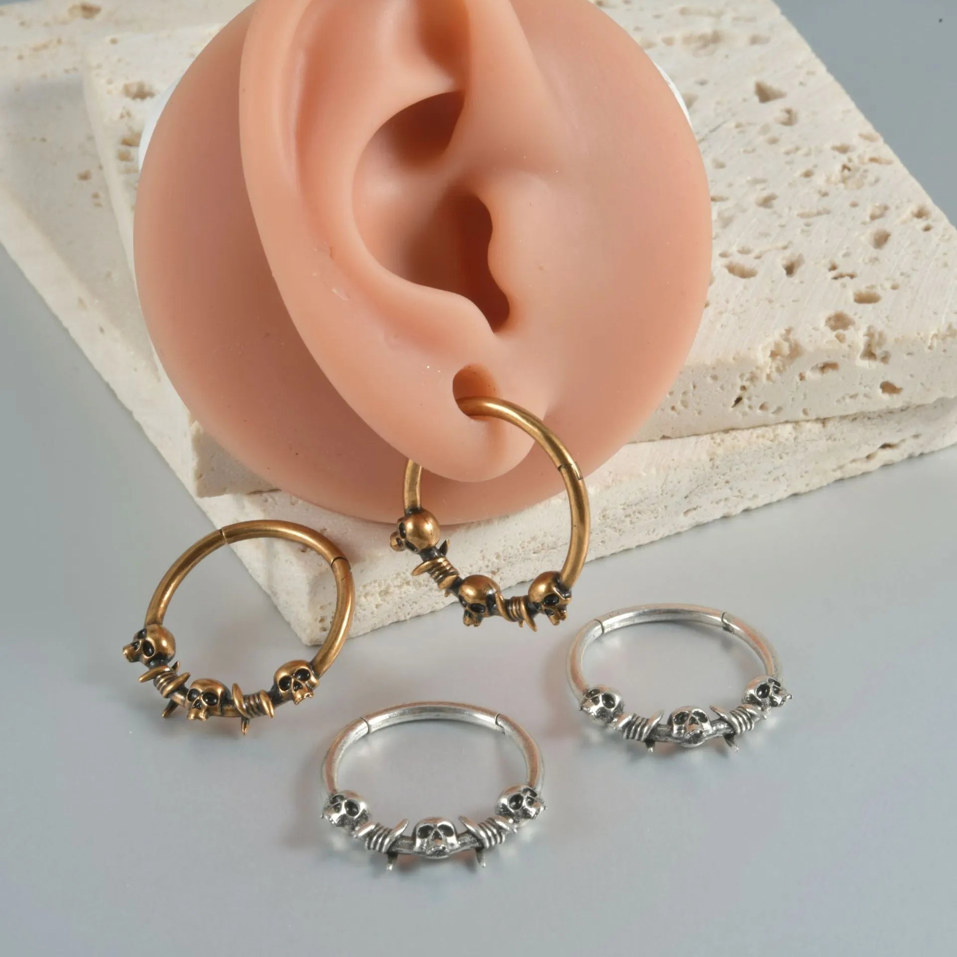 Copper punk earrings with ghost head design in antique silver and gold finishes