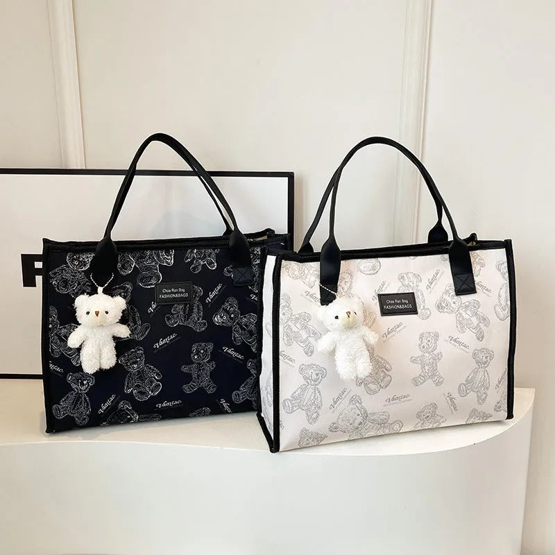 Women's black and white printed canvas tote bag with rhombus pattern and shoulder strap
