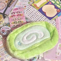 Honeydew roll plush velvet pencil case with Swiss roll cake design in beige, brown, and cream colours