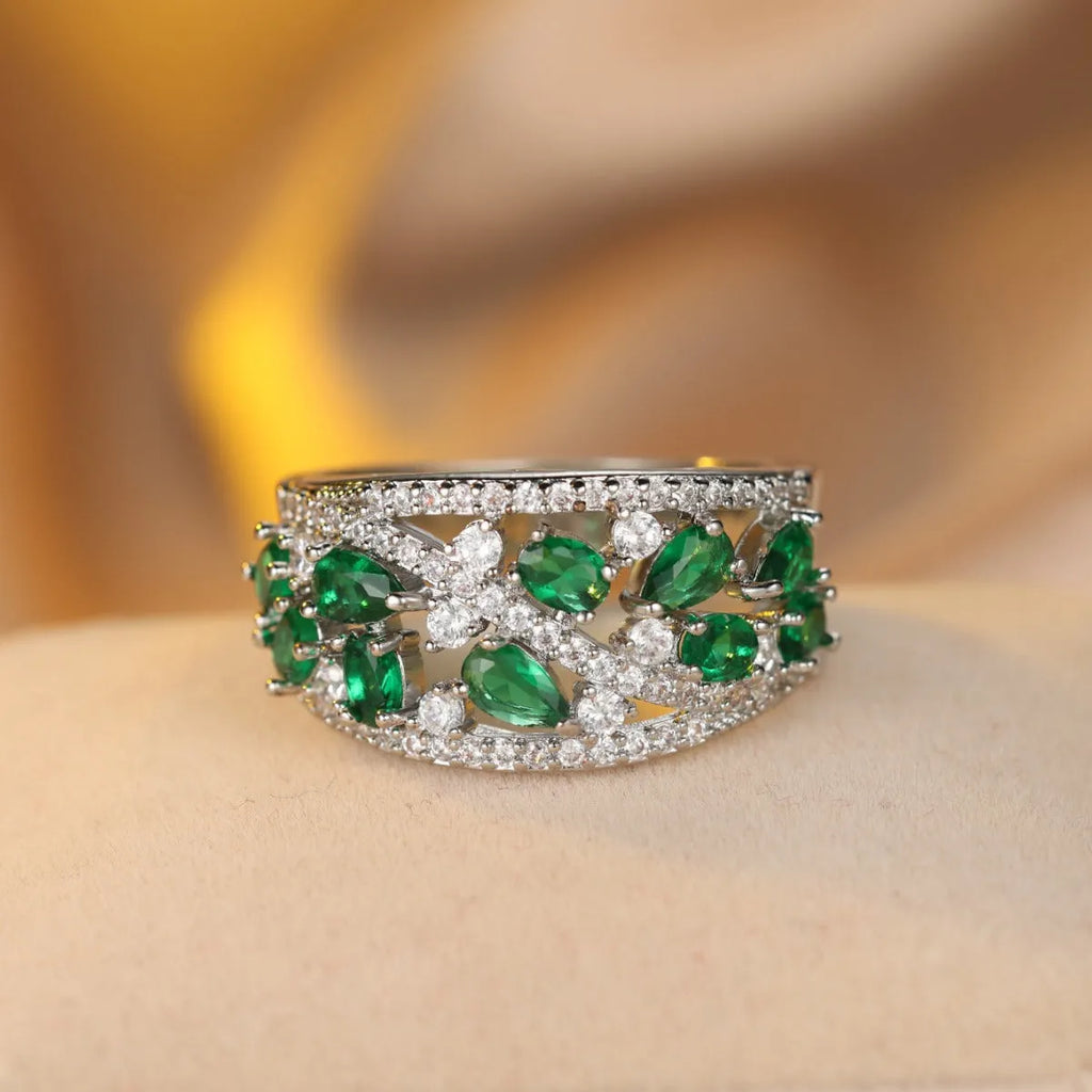 Women's round hollow copper ring with a central stone, shown in gold and platinum finishes.