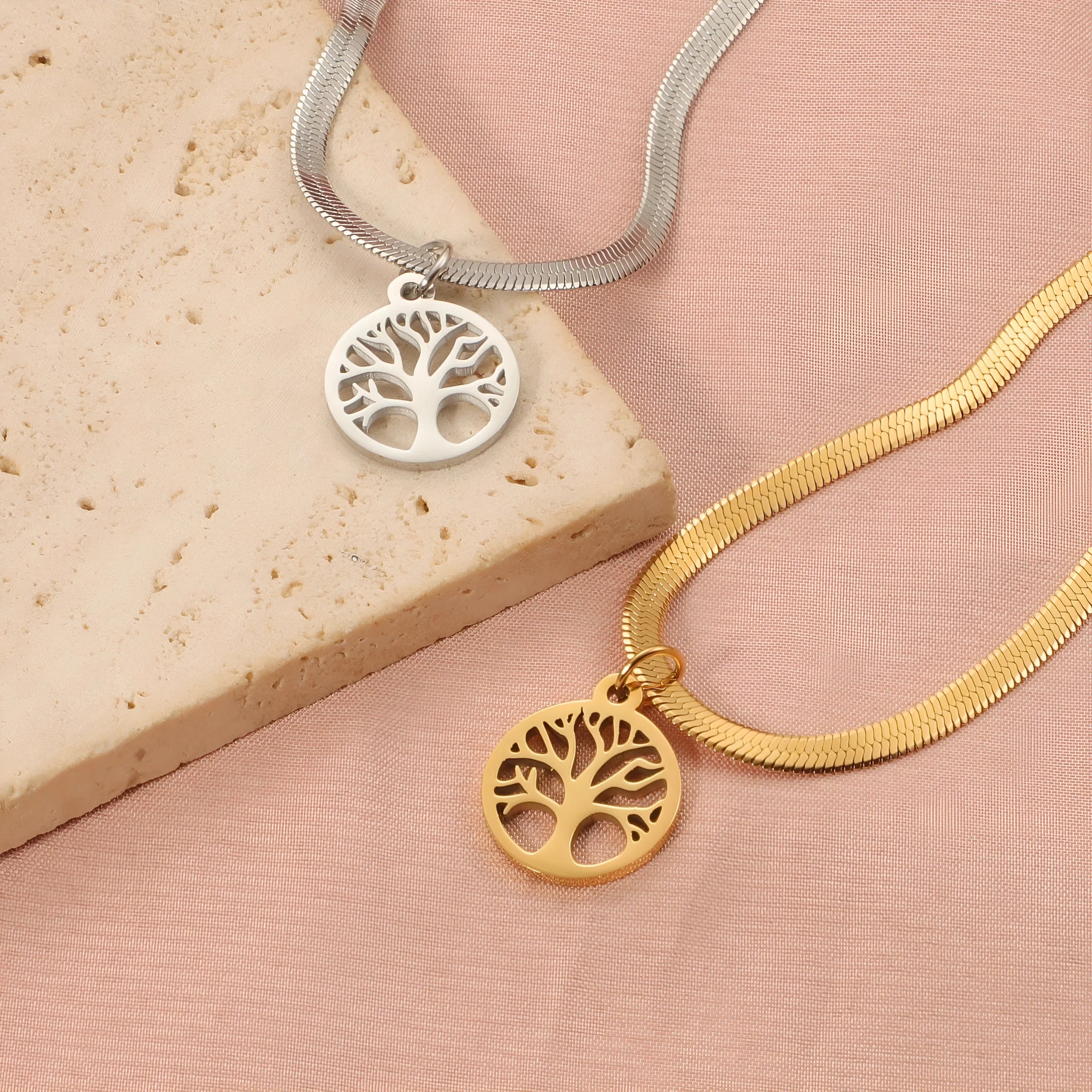Stainless steel necklace with tree pendant on adjustable snake chain in gold and steel colours.