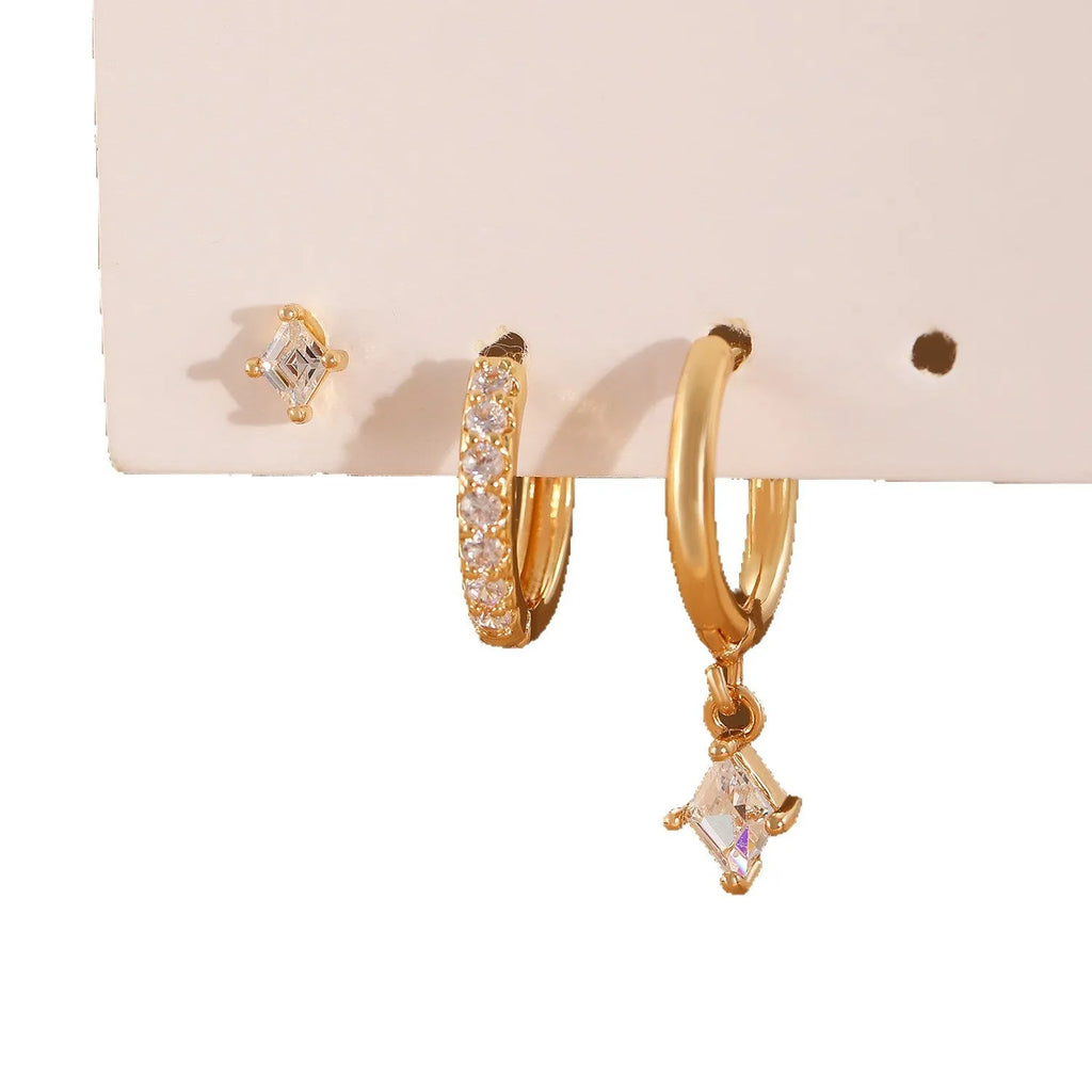 Three-piece geometric zircon jewellery set with pendant, ear clips and stud earrings in gold tone