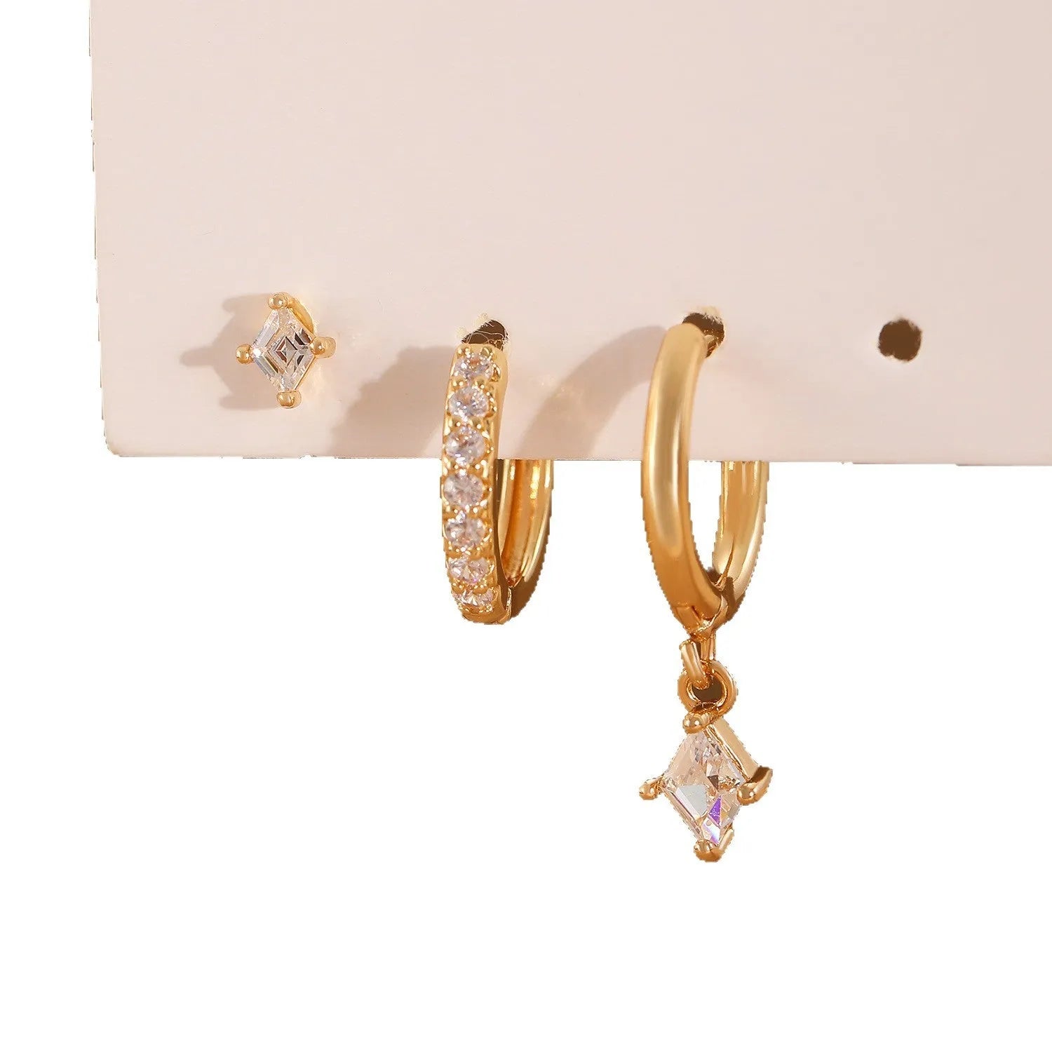 Three-piece geometric zircon jewellery set with pendant, ear clips and stud earrings in gold tone
