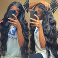 Black synthetic long curly wig with side bangs and a front lace hairline, shown at different lengths.