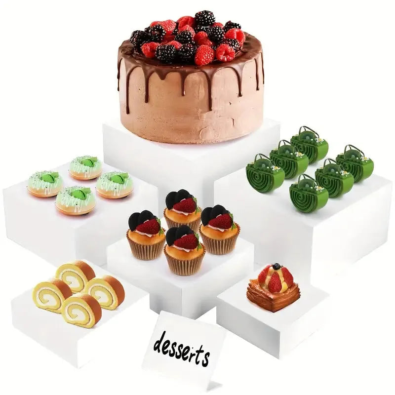 White plastic suit cube dessert display stand with six-piece arrangement for tabletop cake presentation