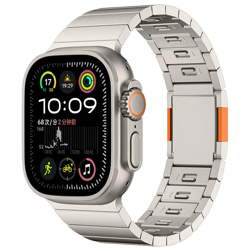 Stainless steel magnetic buckle Apple Watch replacement band in silver colour on a wrist.