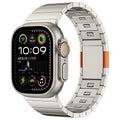 Stainless steel magnetic buckle Apple Watch replacement band in silver colour on a wrist.