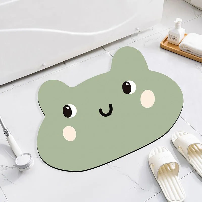 Colourful cartoon animal diatomite absorbent bathroom mat in alien shape on tiled floor.