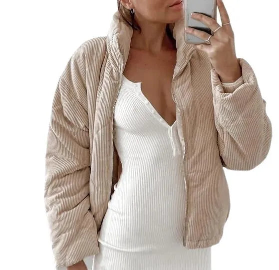 Apricot coloured women's corduroy jacket with stand collar, front zipper, and long sleeves.