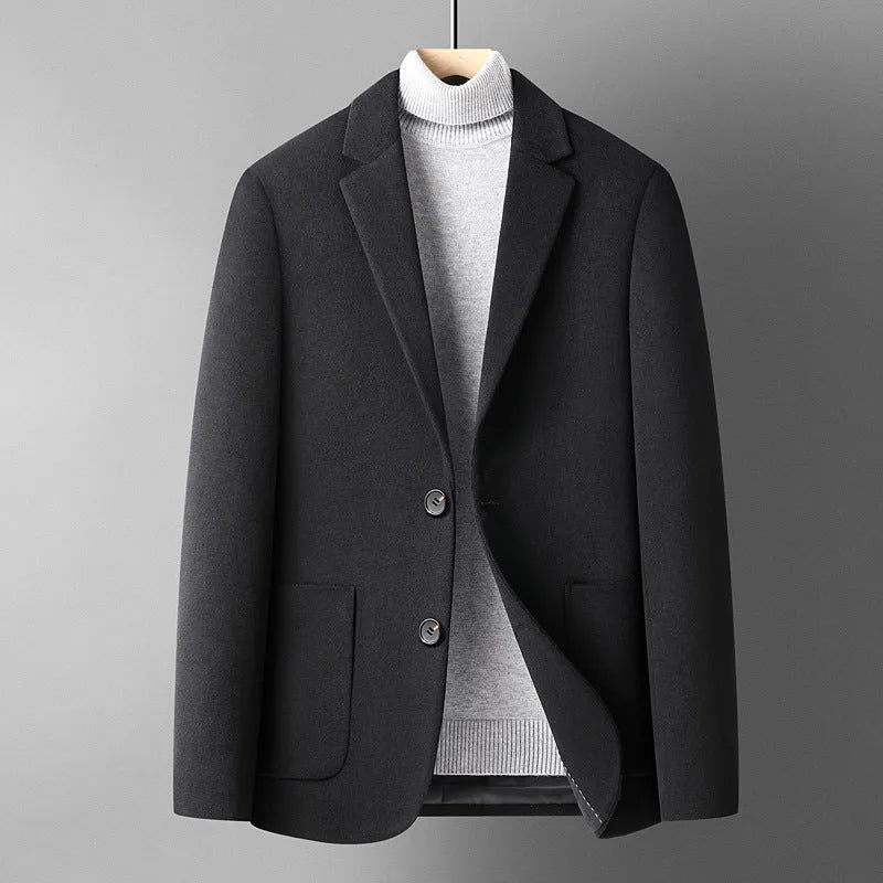 Men's slim fit wool suit jacket in grey on a hanger, showing notch lapel and button front.