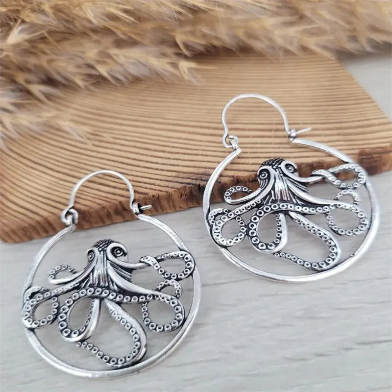 Vintage antique silver octopus earrings with detailed tentacles, retro animal zodiac design.