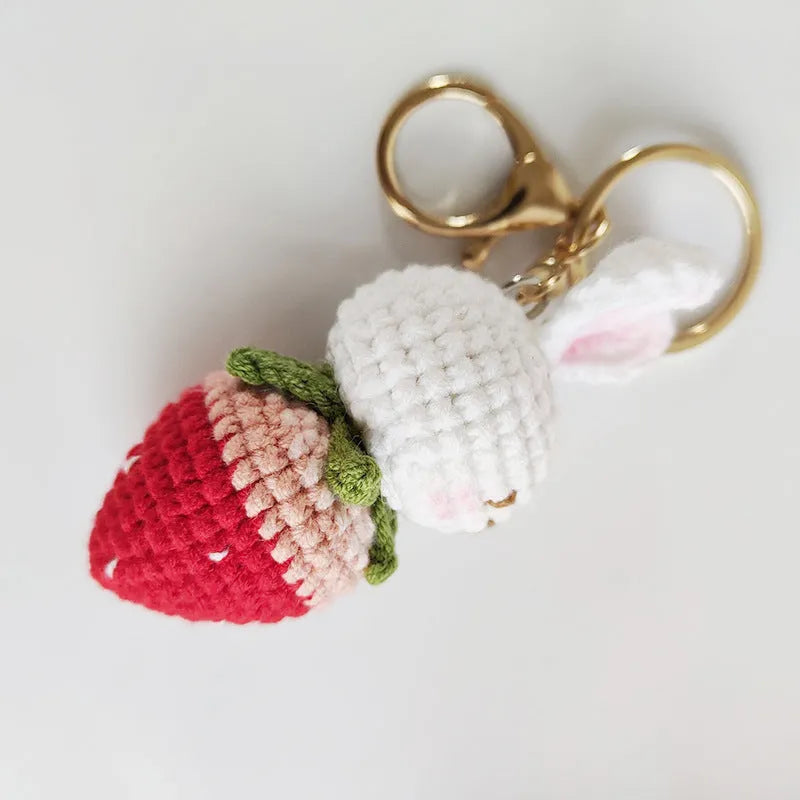 Hand-woven rabbit pendant with strawberry pattern made from four-strand wire with key attachment